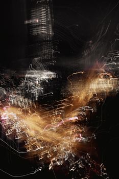 Dynamic abstract image of city lights captured during night, showing urban vibrance.