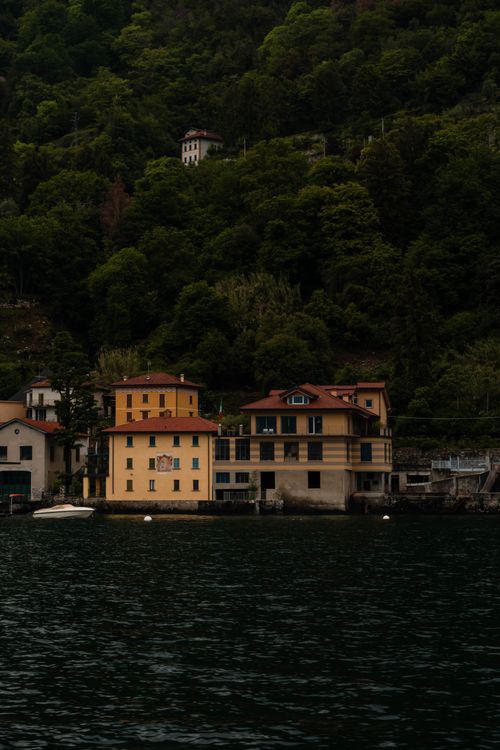 Free Explore the lush lakeside beauty with charming houses nestled by Lake Lugano, Switzerland. Stock Photo