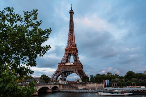 Eiffel Tower by Seine River in Paris, France