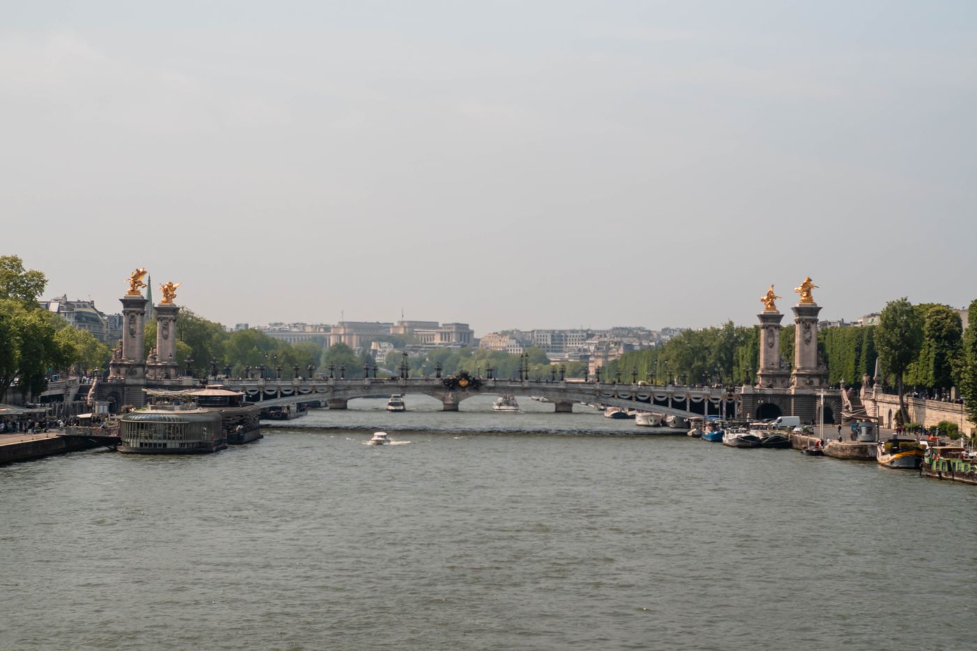Pont Alexandre III and the Seine in Paris, with the bridge's gilded statues on their columns