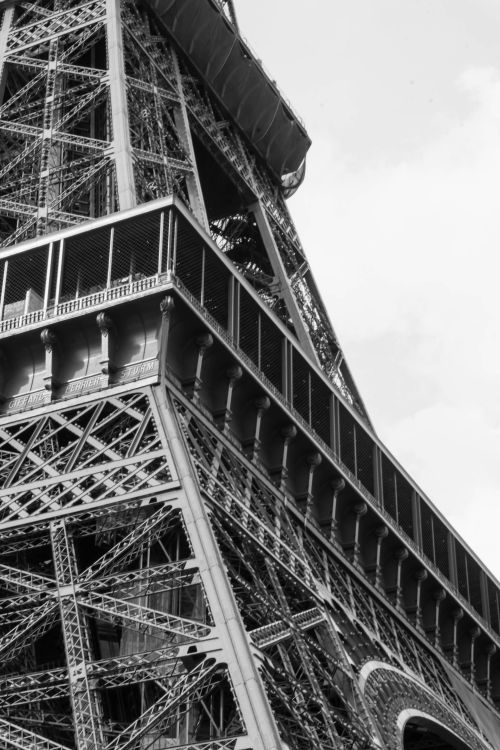 Free Black and white close-up of Eiffel Tower's intricate iron lattice in Paris, France. Stock Photo