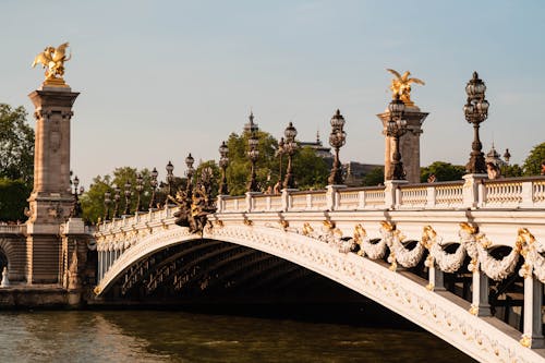 Golden Statues on Alexandre III Bridge in Paris