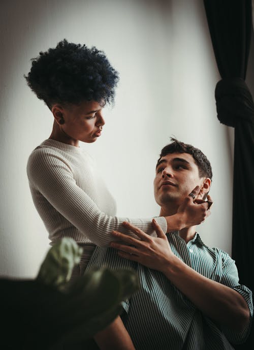 A man and woman are looking at each other