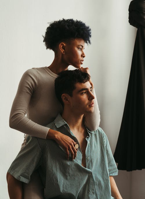 A man and woman sitting on a couch together