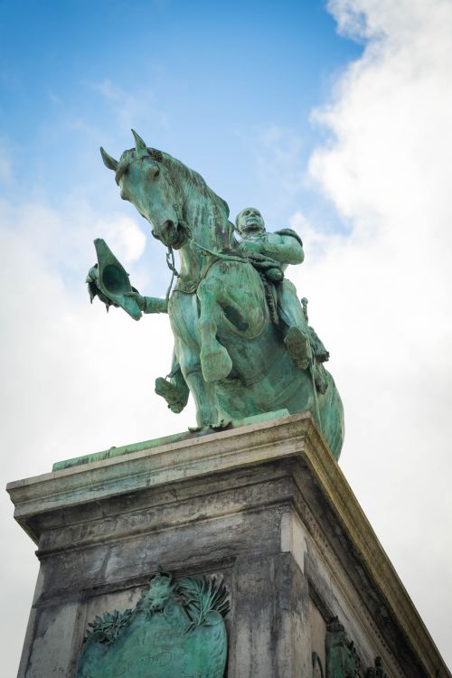 Free Statue of a historical figure on horseback in Luxembourg City under a bright blue sky. Stock Photo