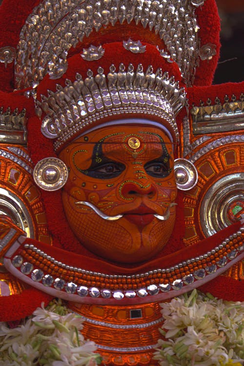 A close up of a face painted in indian style
