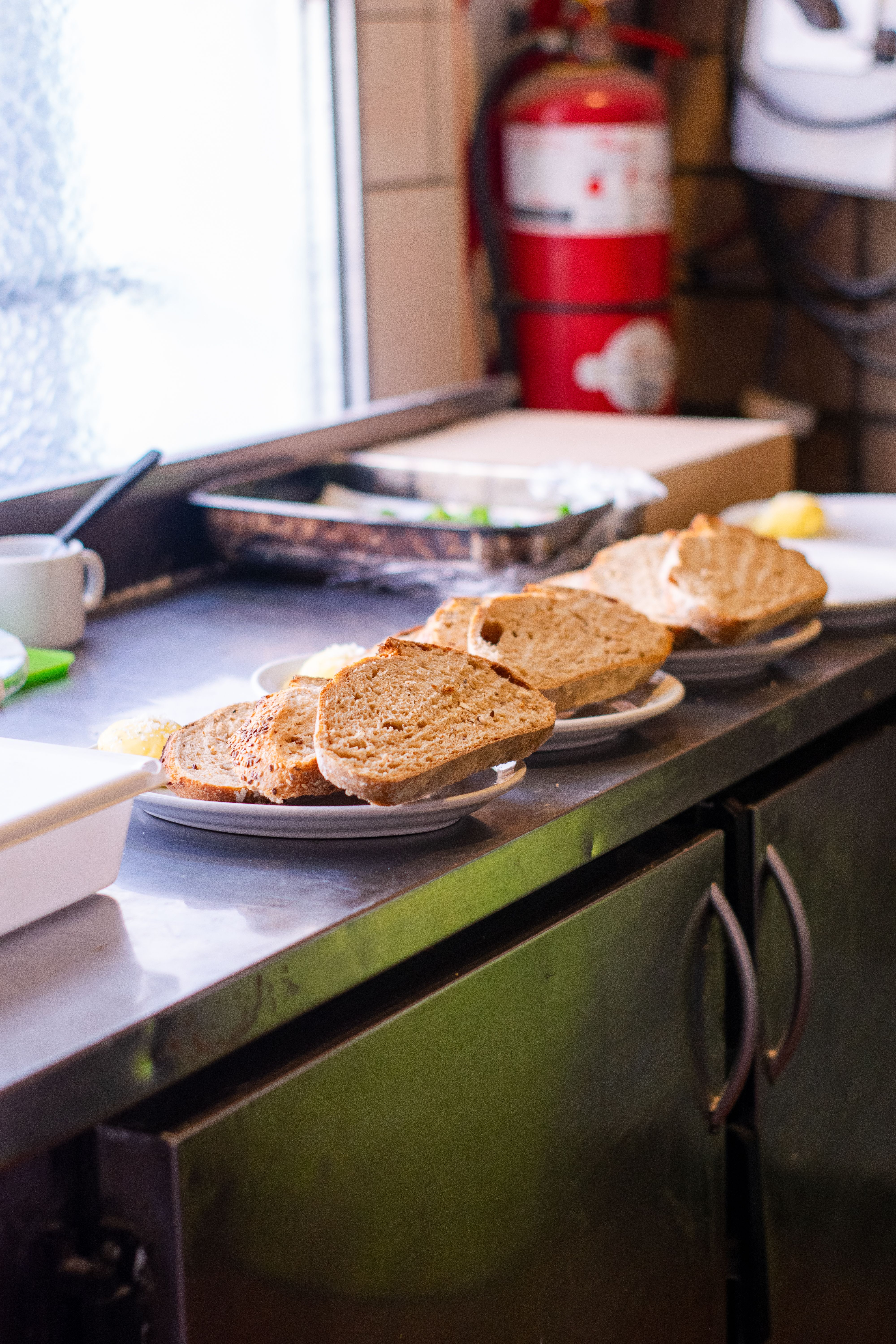 Slices of Bread on Plates in Kitchen · Free Stock Photo