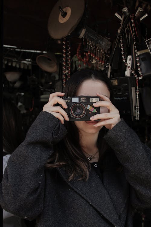 A woman taking a photo with her camera