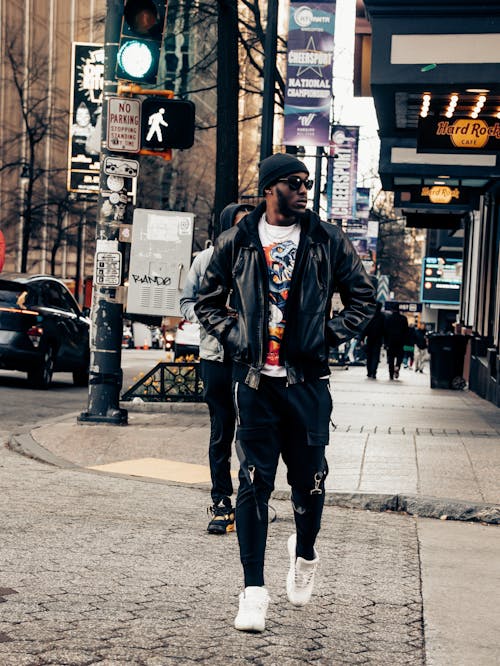 Black fashion model walking in the street 