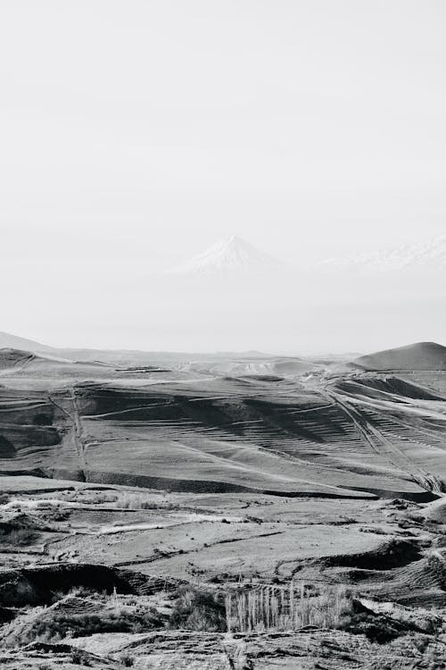 Black and white photo of mountains and valley