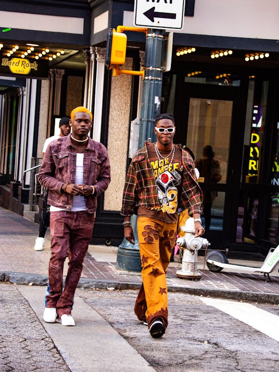 2 black fashion models walking in the street 