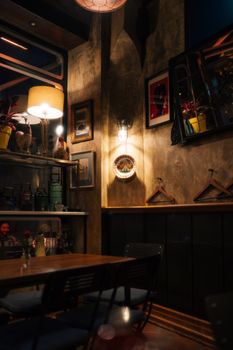 Warm café interior featuring rustic design, ambient lighting, and decorative elements.