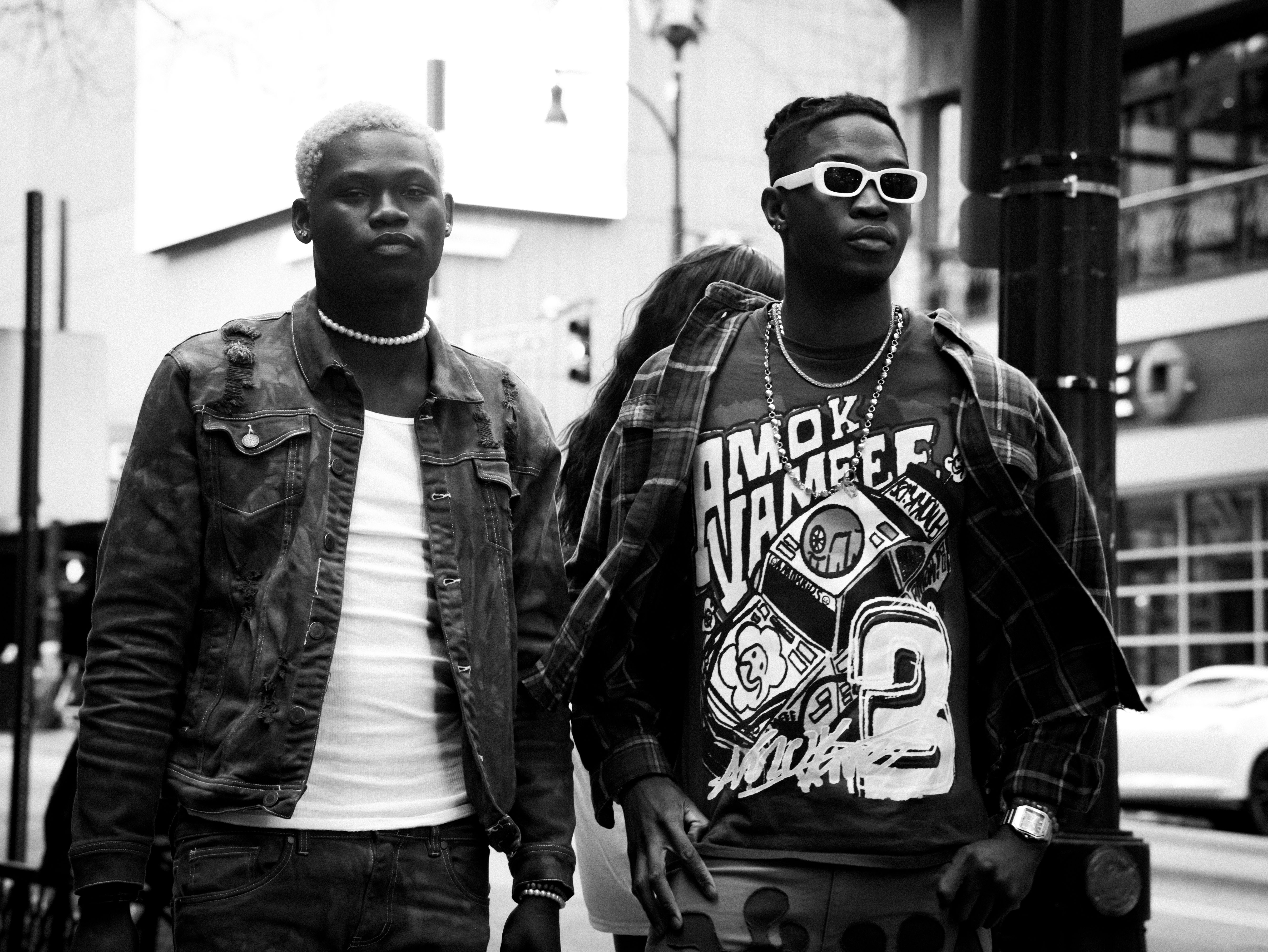 Stylish urban fashion captured in black and white on Atlanta's streets.