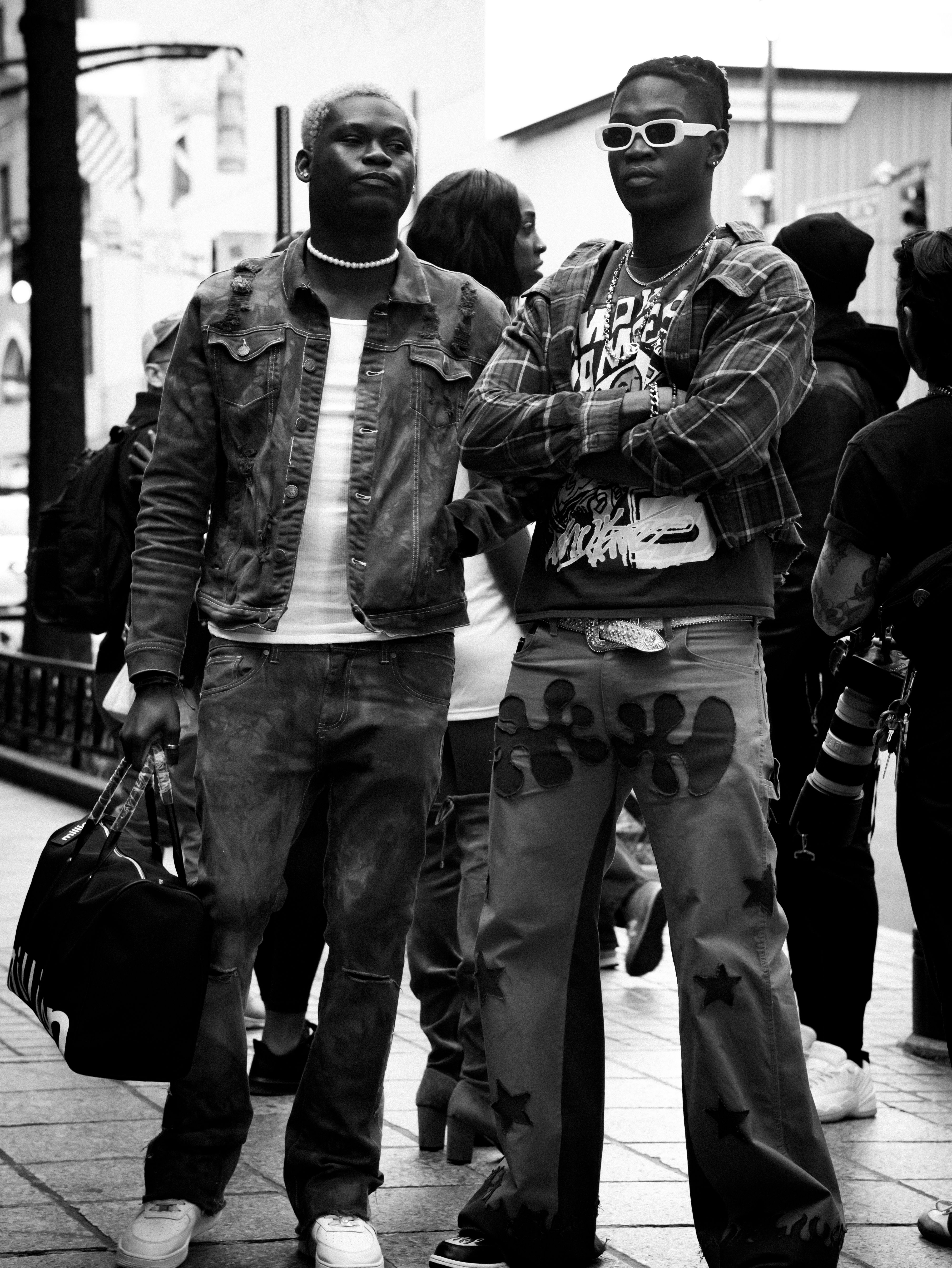 Black and white photo of two men showcasing urban street fashion in downtown Atlanta.