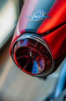 Detailed vertical shot of an MV Agusta motorcycle's red taillight showcasing modern design.