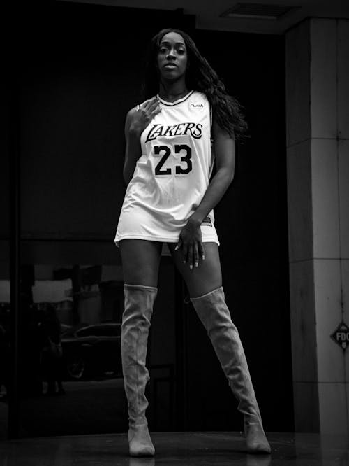 beautiful black fashion model posing in basketball jersey 