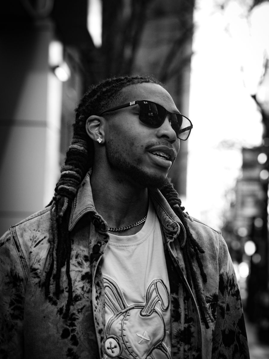 Black and white portrait of a streetwear fashion model wearing sunglasses