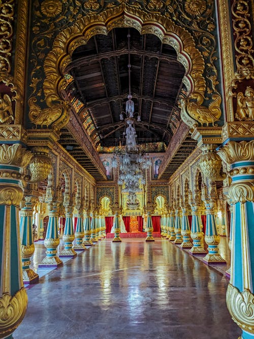 The inside of a temple with gold and blue decorations