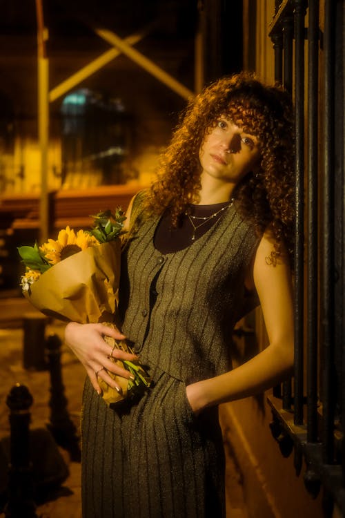 Portrait of Woman with Flowers at Night