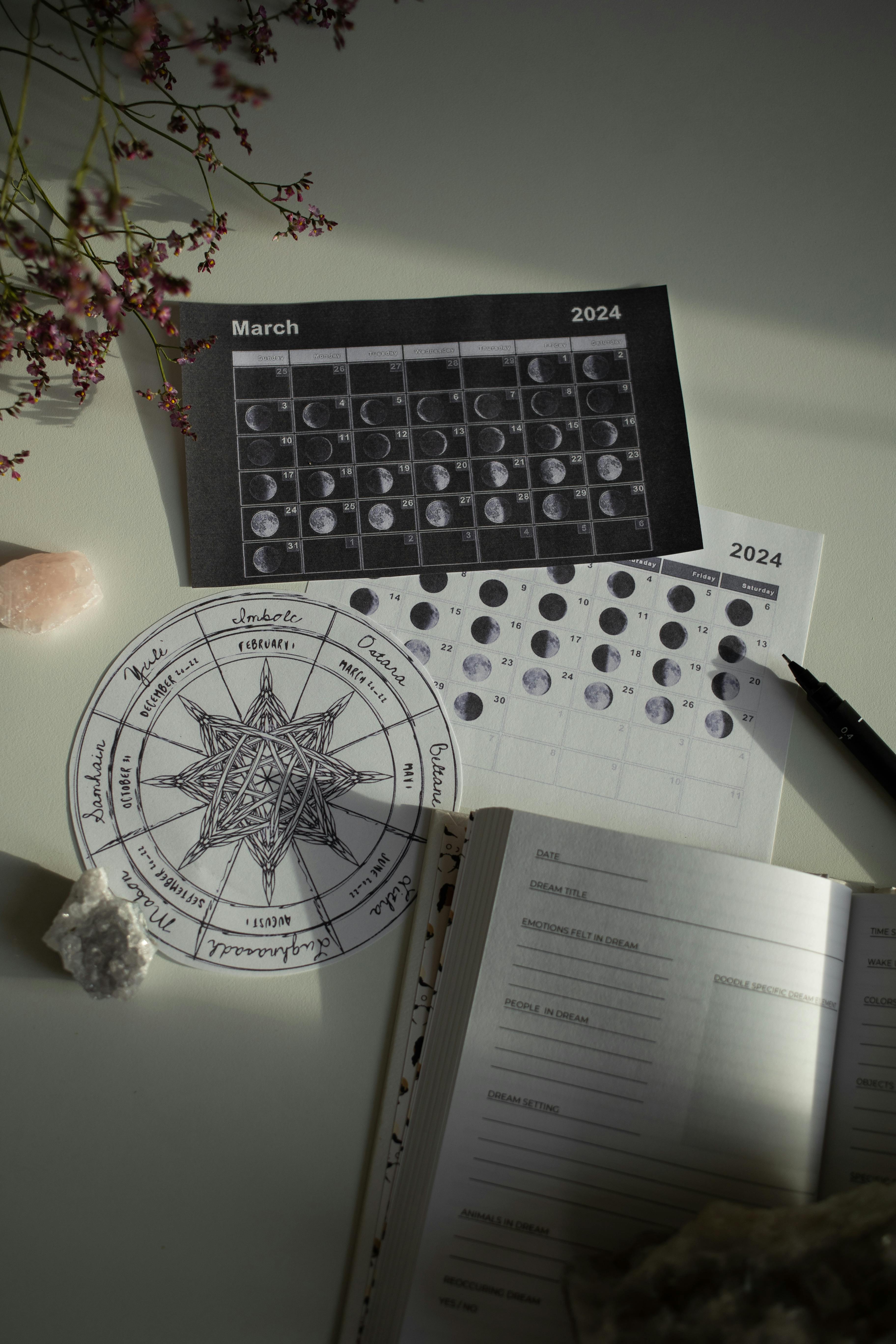 Wheel of Year and Calendar on White Desk · Free Stock Photo