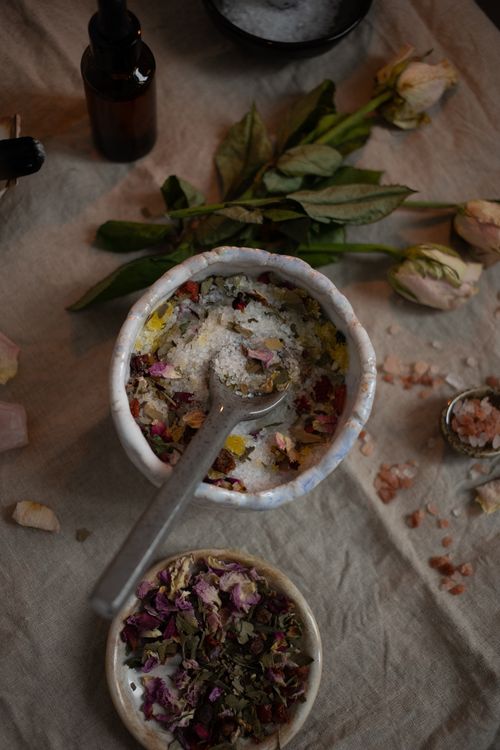 Free A flat lay of herbal bath salts mixed with dried petals and essential oils, creating a soothing aroma. Stock Photo