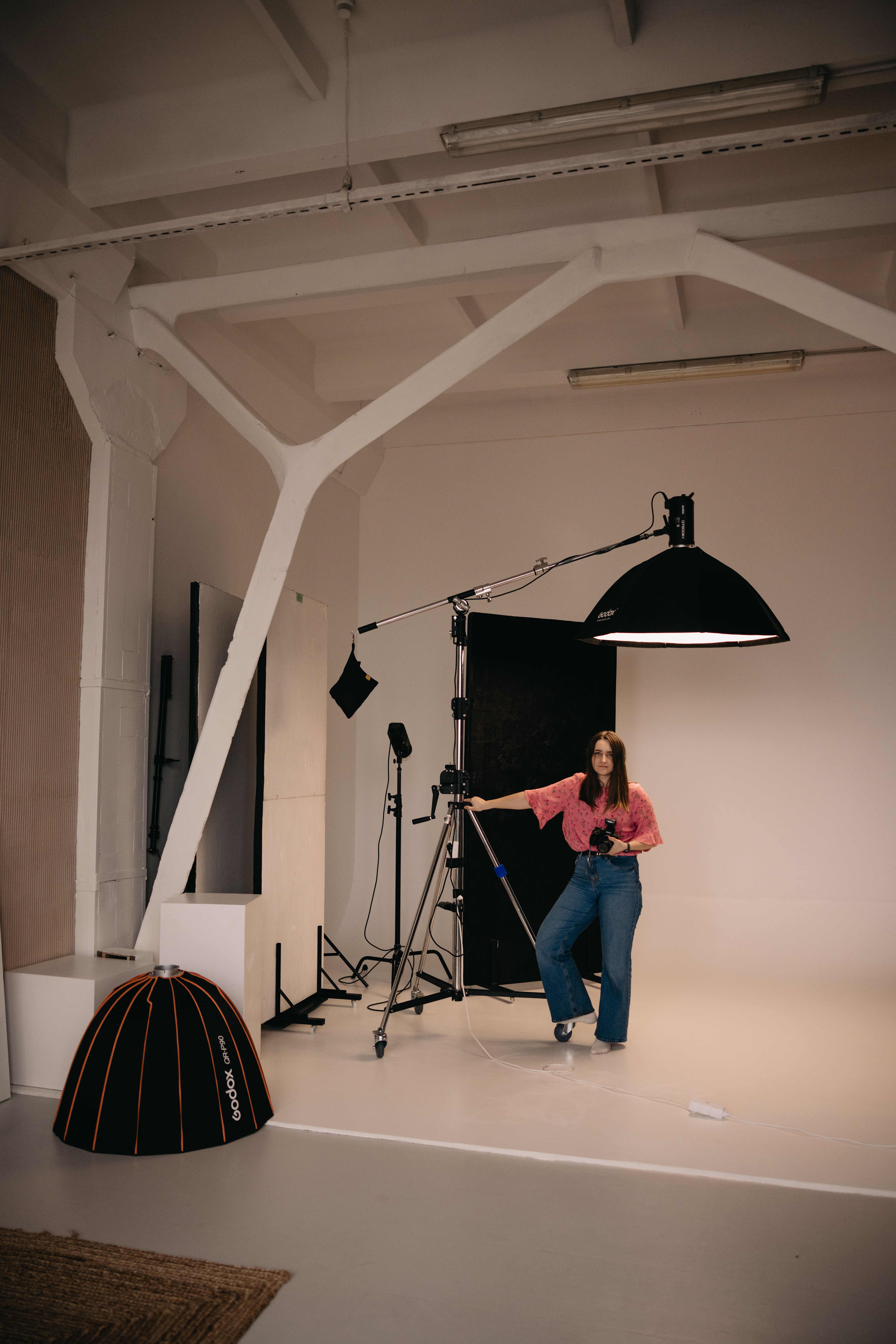 Model and photographer working in a fashion studio