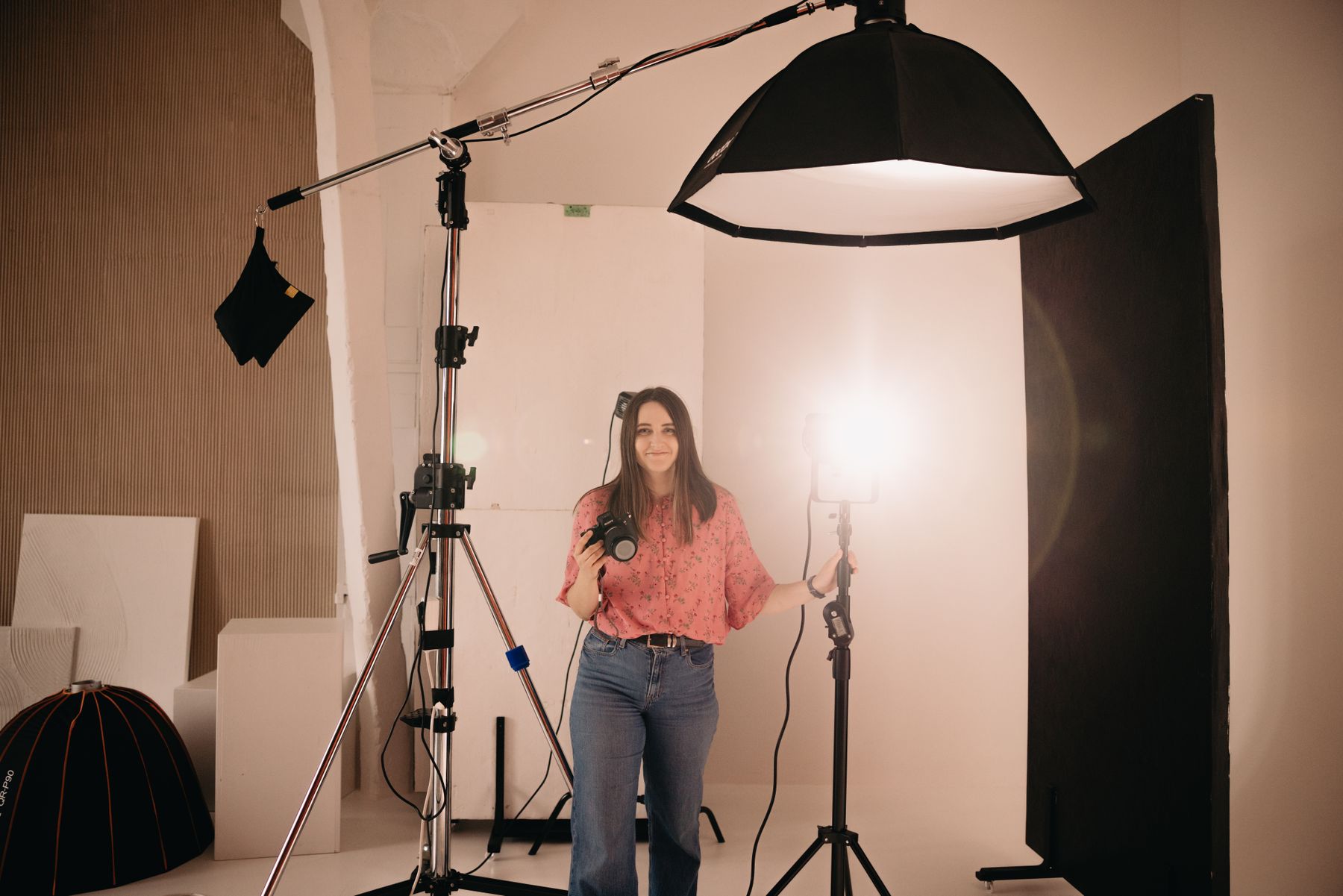 Photographer working with studio lighting at Photo Pixel Park Studio