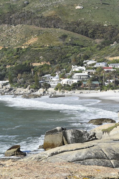 Free Stunning vista of Glen Beach with houses and mountain backdrop in Cape Town, South Africa. Stock Photo