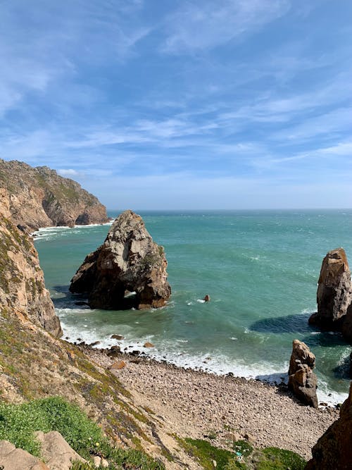 The view from the top of a cliff overlooking the ocean