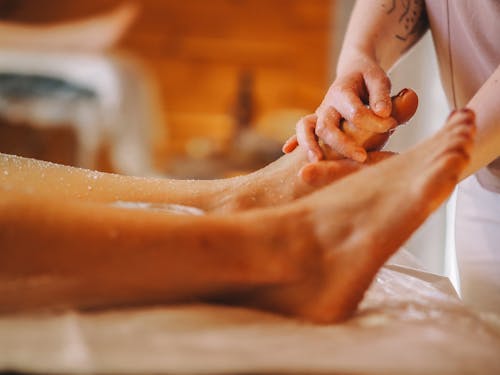 A person getting a foot massage in a spa