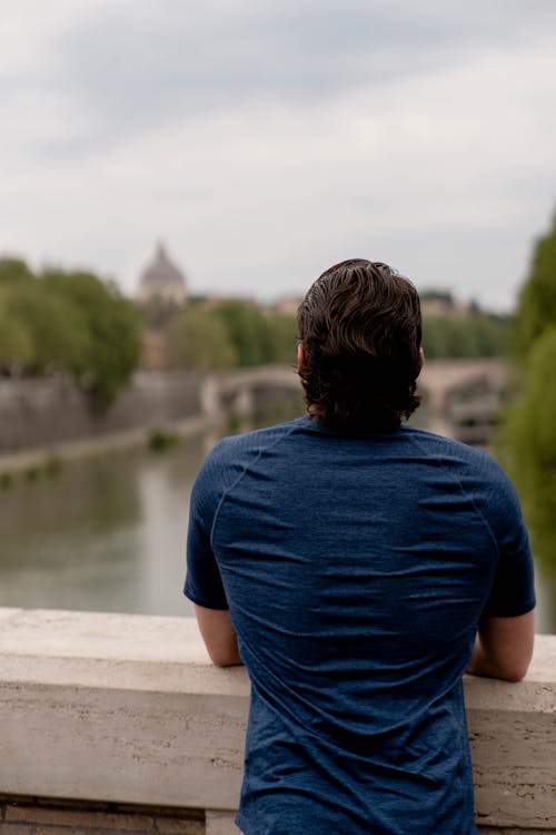 A man looking out over the city of rome