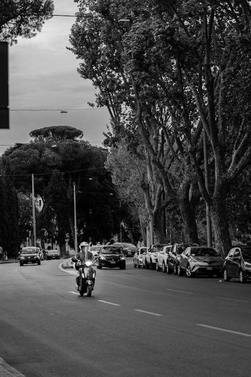 A black and white photo of a motorcycle on a street