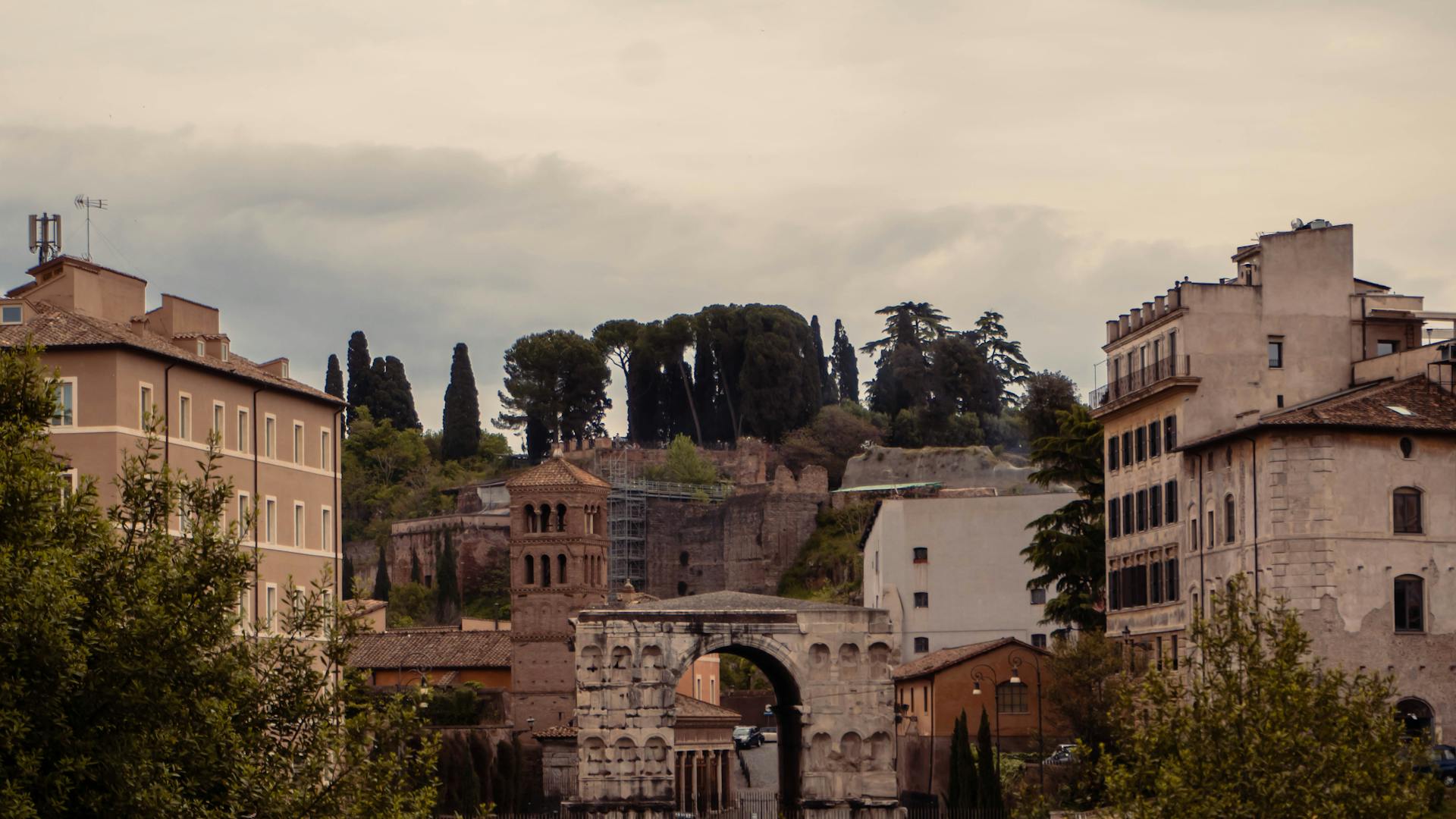 Capture of the ancient Arch of Janus amidst the charming architecture of Rome.