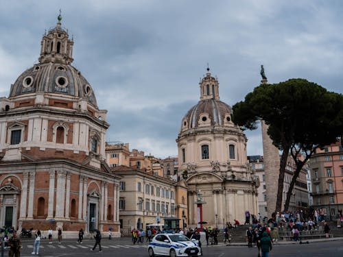 A city street with a church and a car