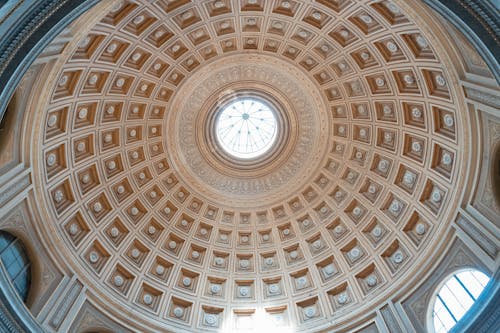 The ceiling of a circular building with a dome