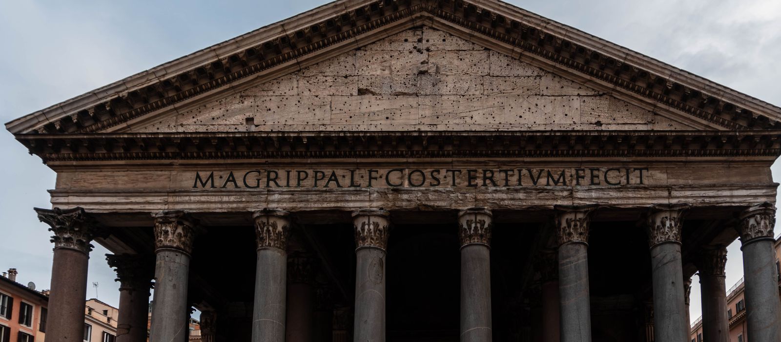 Close-up view of the iconic Pantheon facade in Rome, showcasing its ancient Roman architecture.