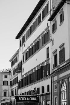 Elegant black and white image of classic Italian buildings in Rome.