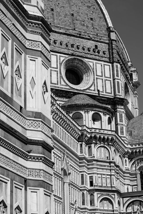 Free A detailed view of the ornate facade of Florence Cathedral, showcasing its gothic architecture. Stock Photo