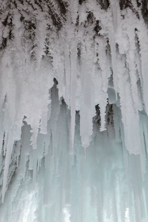 Free Dramatic close-up of icy stalactites in a frozen cave showcasing winter beauty. Stock Photo