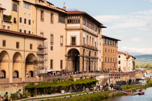 Free Historic Uffizi Gallery by the Arno River in Florence, showcasing Renaissance architecture. Stock Photo