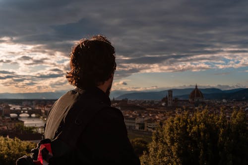 A man looking out over the city of florence