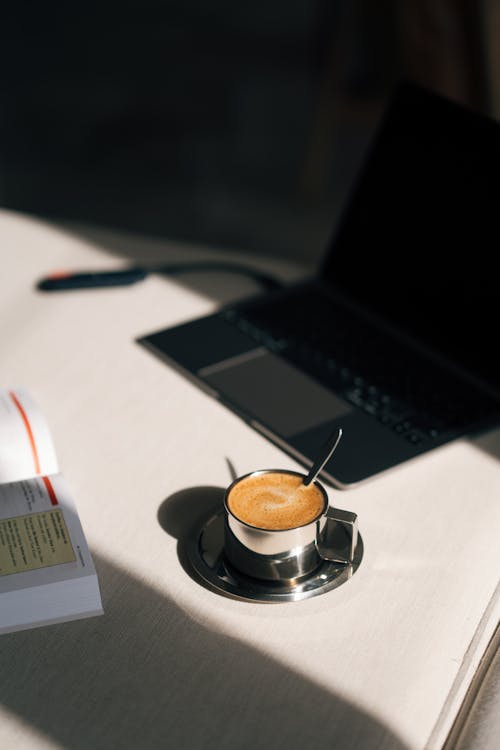 Free Coffee Cup and Laptop on Desk Stock Photo