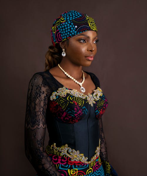 Studio Shot of Model in Embellished Dress and Hat