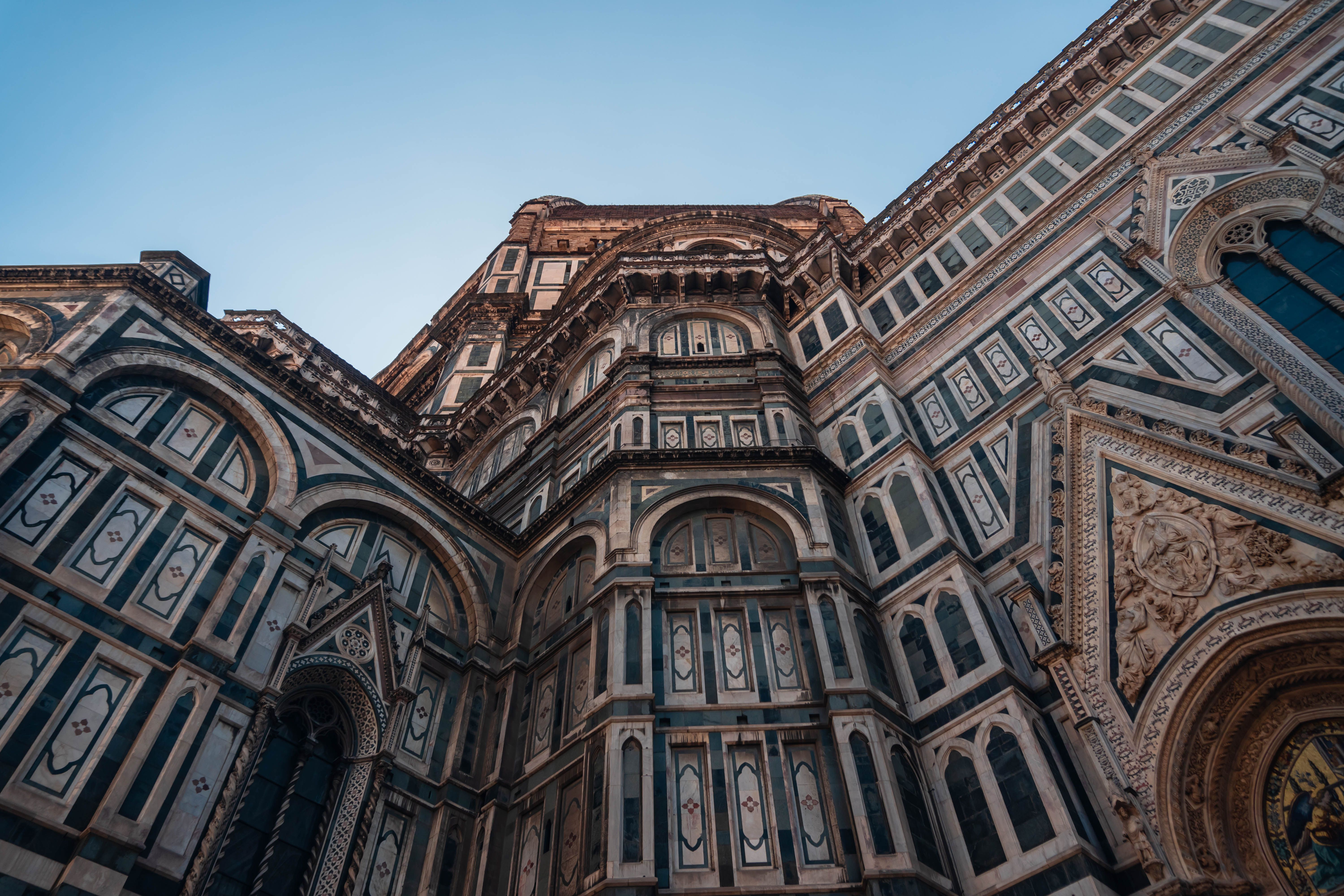 Detailed view of Florence Cathedral's intricate Gothic facade, an iconic Italian landmark.