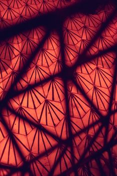 Intriguing geometric patterns with red and black color shades creating an abstract design.
