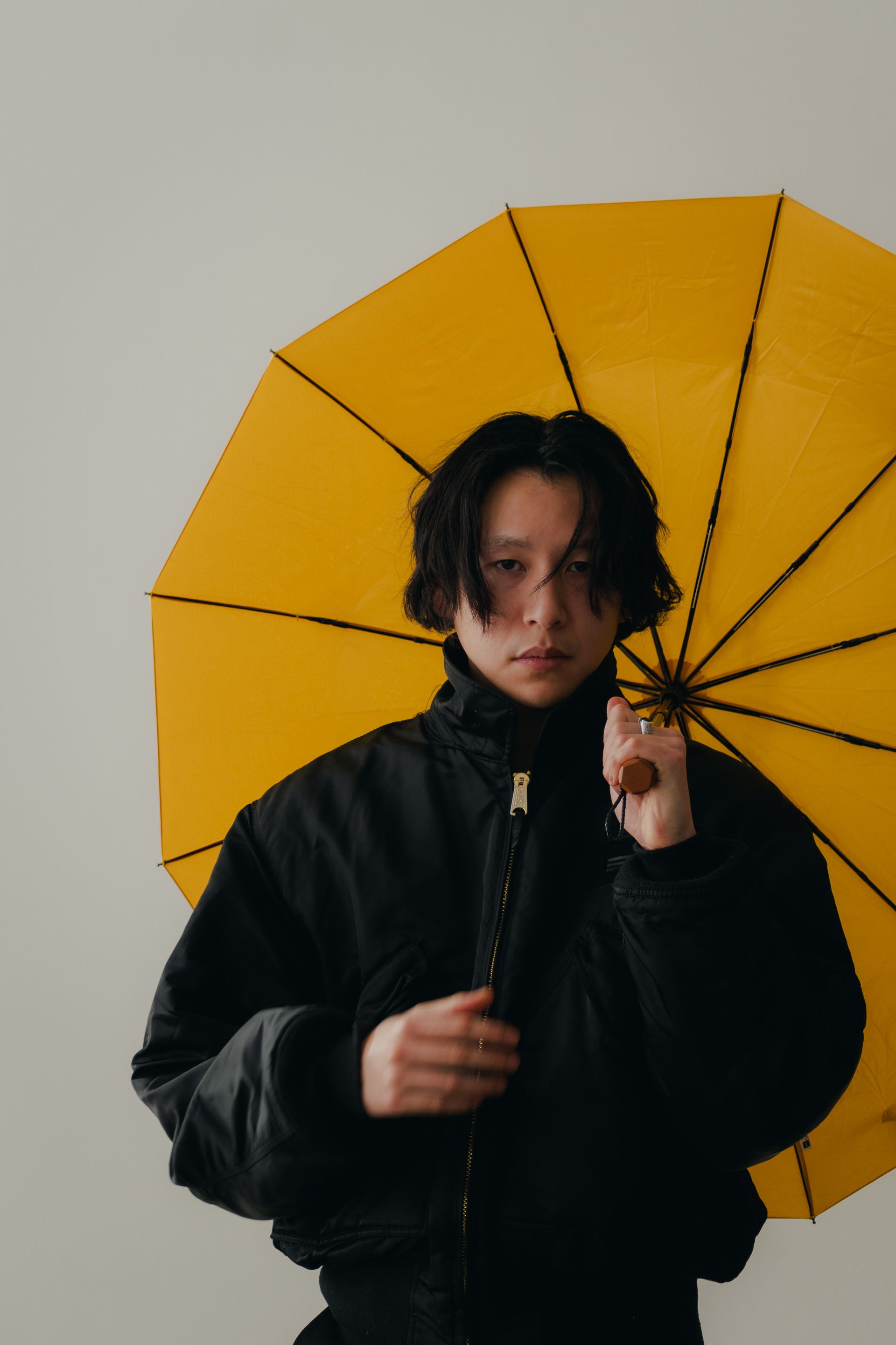 Portrait of Man in Jacket and with Yellow Umbrella · Free Stock Photo