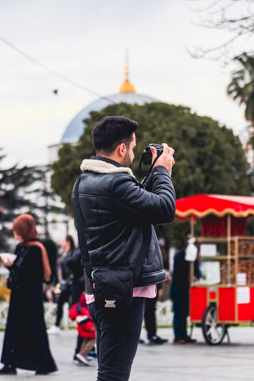 Man in Fur Jacket Photographing on Street in Istanbul