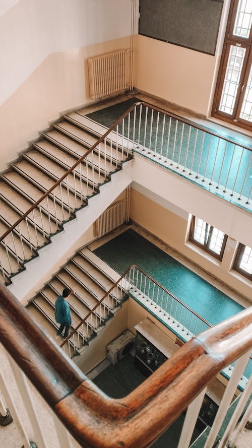 Person Walking Up Stairs in Public Building