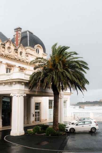 Neoclassical architecture with palm tree, coastal view in Biarritz, France.