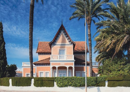 A house with palm trees in front of it